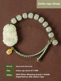 Hetian jade rabbit charm bracelet with sterling silver card on a white ice cotton rope.