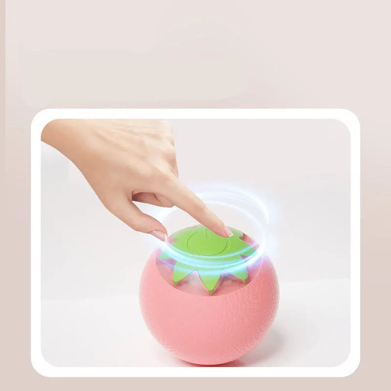 Automatic electric rolling ball pet toy for dogs and cats, 4.5cm cube in green, pink, or yellow.