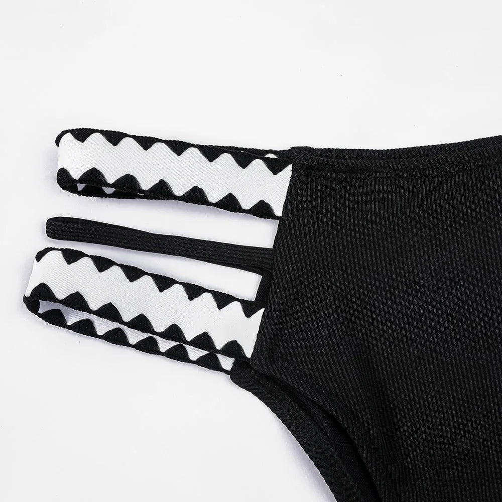 Black women's hollowed-out split swimsuit bikini briefs in polyester fabric