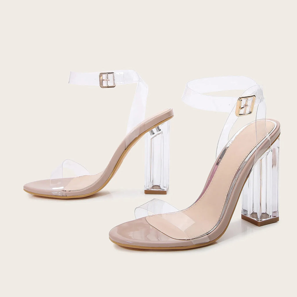Apricot-coloured women's high heel sandals with a clear glass heel and a buckle strap fastener.