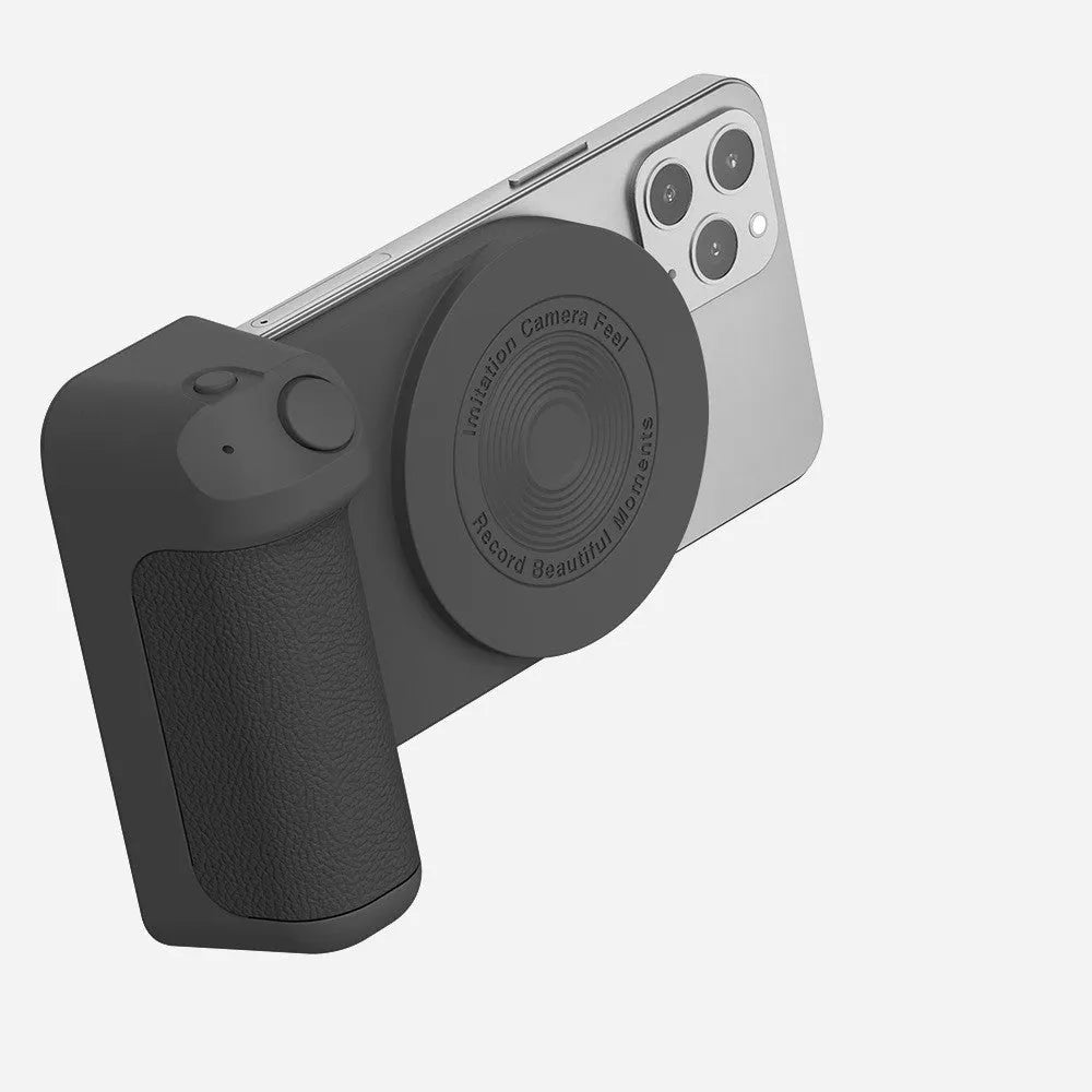 Black magnetic phone camera grip holder with rotatable bracket on a table.