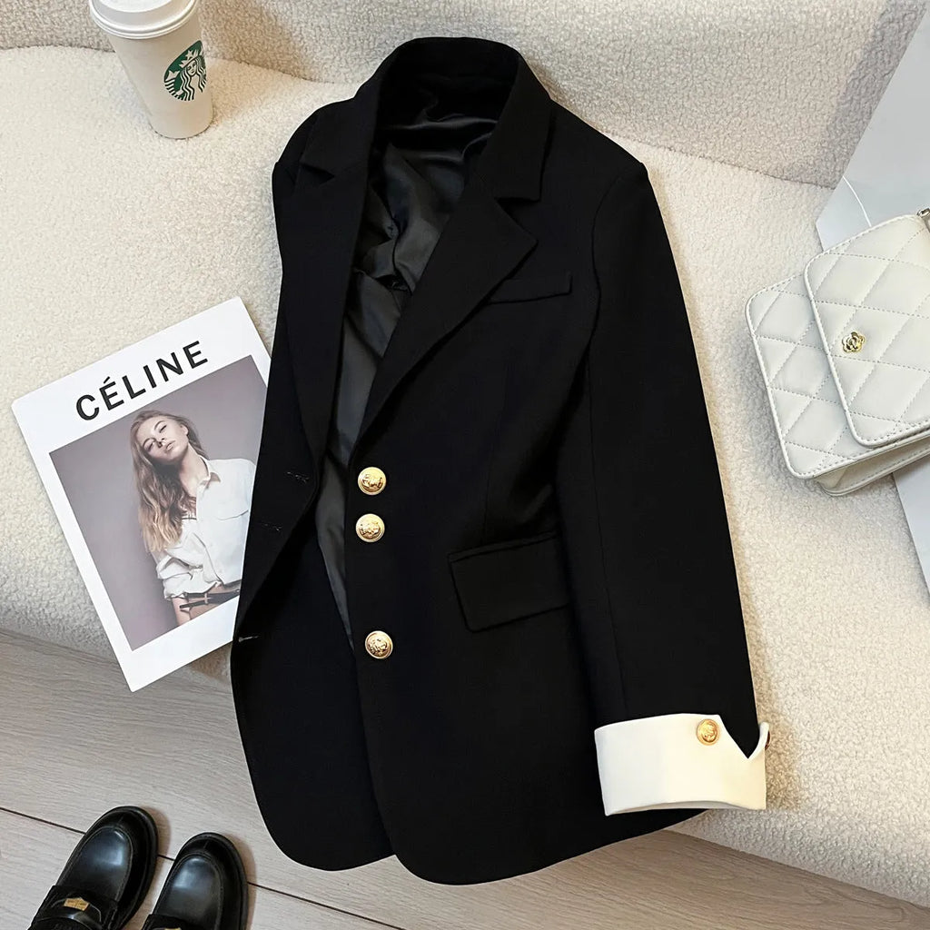Korean style loose fit women's coat in beige and black with long sleeves and pockets.