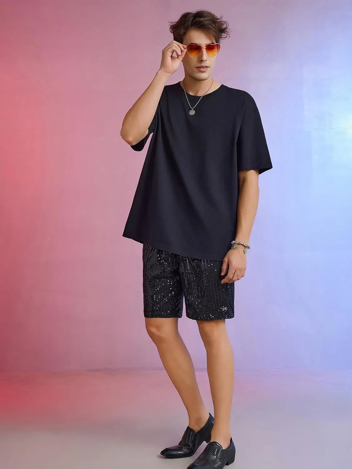 Men's silver sequin straight-leg shorts with elastic waistband, shown alongside black colour option.