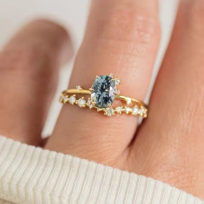 Gold-plated women's ring with green zircon centre stone in floral design showing couple set