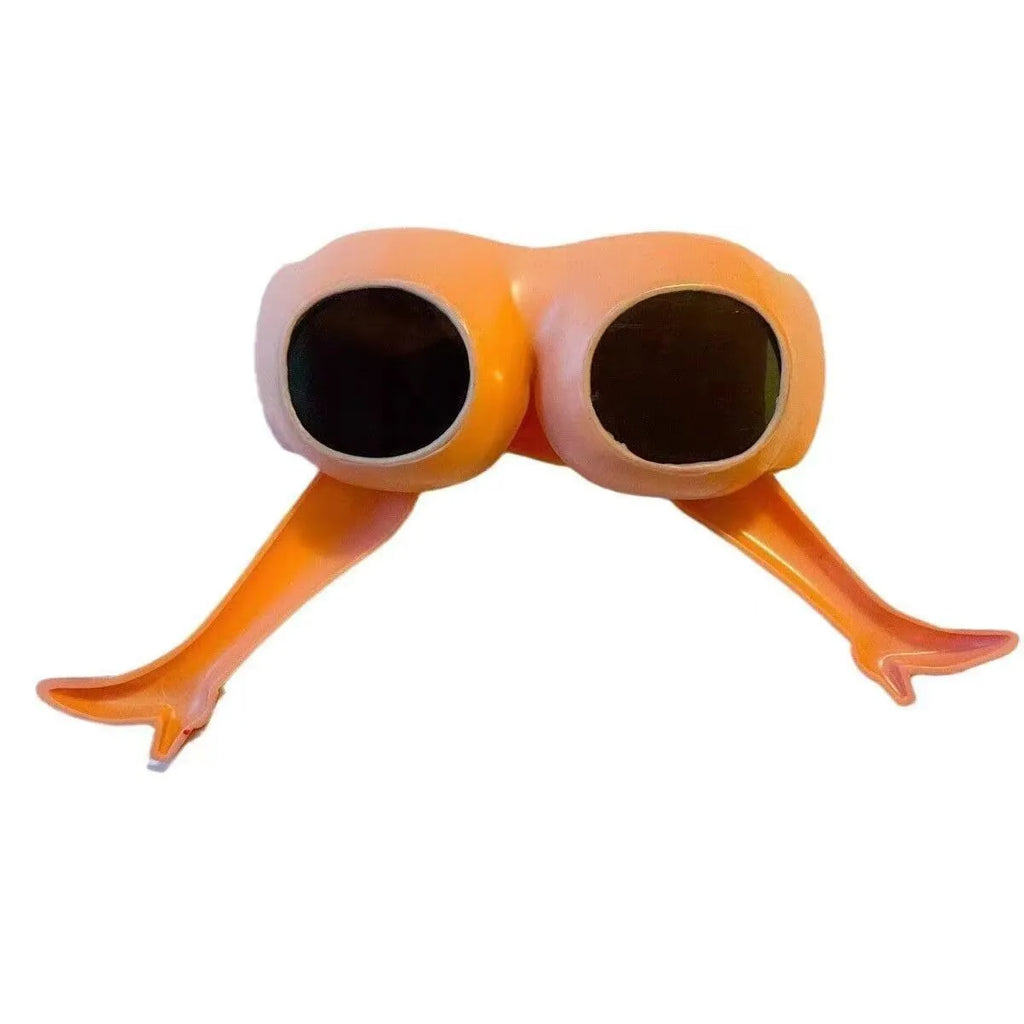 Orange novelty personality sunglasses with leg and hip design, measuring 15cm wide.