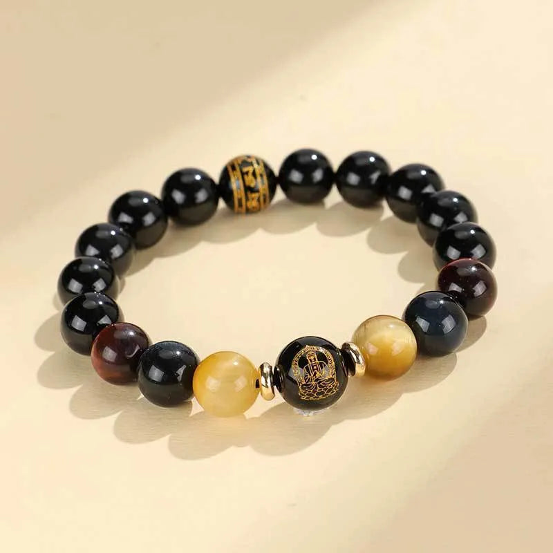 Manually crafted black agate beaded bracelet with gold, blue, and red tiger eye stones, showing ethnic zodiac design.