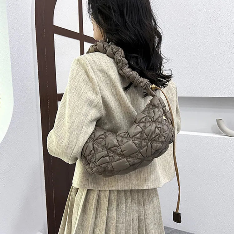 Women's nylon underarm shoulder bag in beige colour showing front view with adjustable strap
