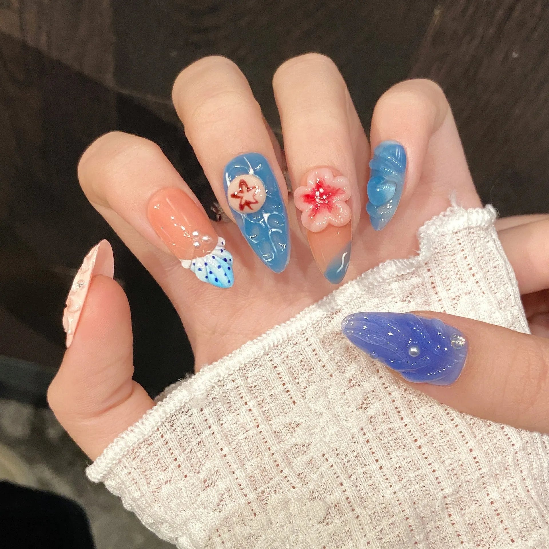 Plastic wearable armour with 3D carved jellyfish design in marine style, almond nail colour