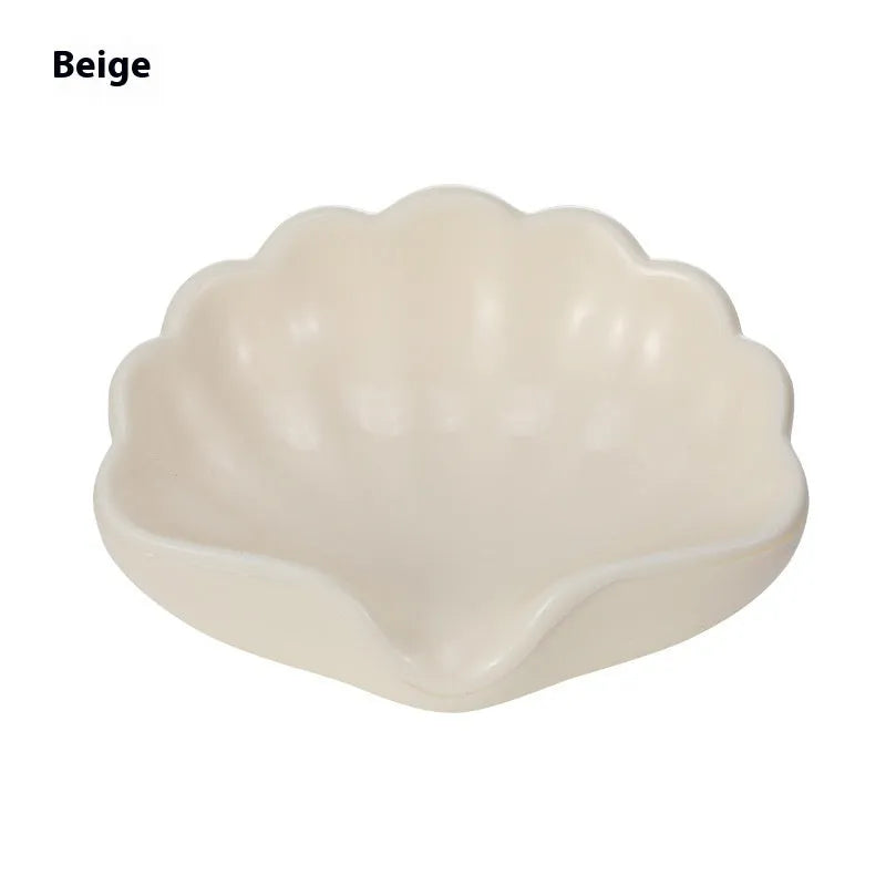 White and pink plastic shell-shaped soap dish for bathroom counter or shower