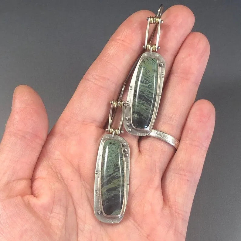 Geometric alloy earrings with two-colour marble pattern on simple drop design