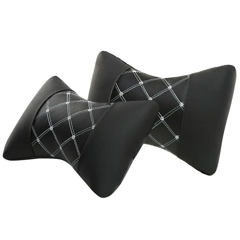 Black quilted diamond pattern car headrest pillow for cervical neck support.