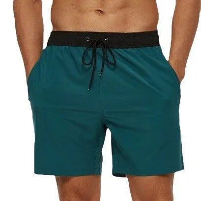Men's blue stitching waist athletic shorts with drawstring and zipper pockets laid flat.