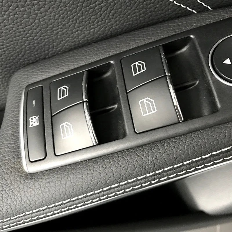 Black glitter decorative sticker for car window lift button panel on door.