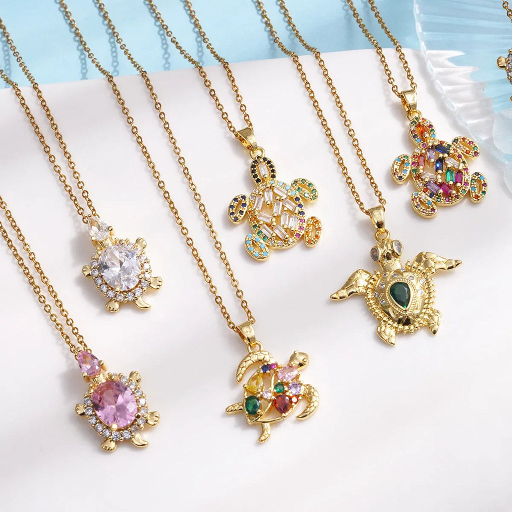 Gold-plated copper sea turtle pendant necklace with mixed gemstone inlay and zirconium encrustation on titanium steel chain