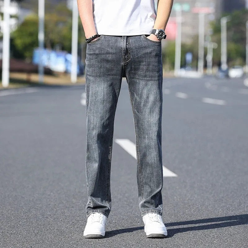 Tapered thin stretch denim trousers for business casual wear in light blue, gray, blue gray, and black.