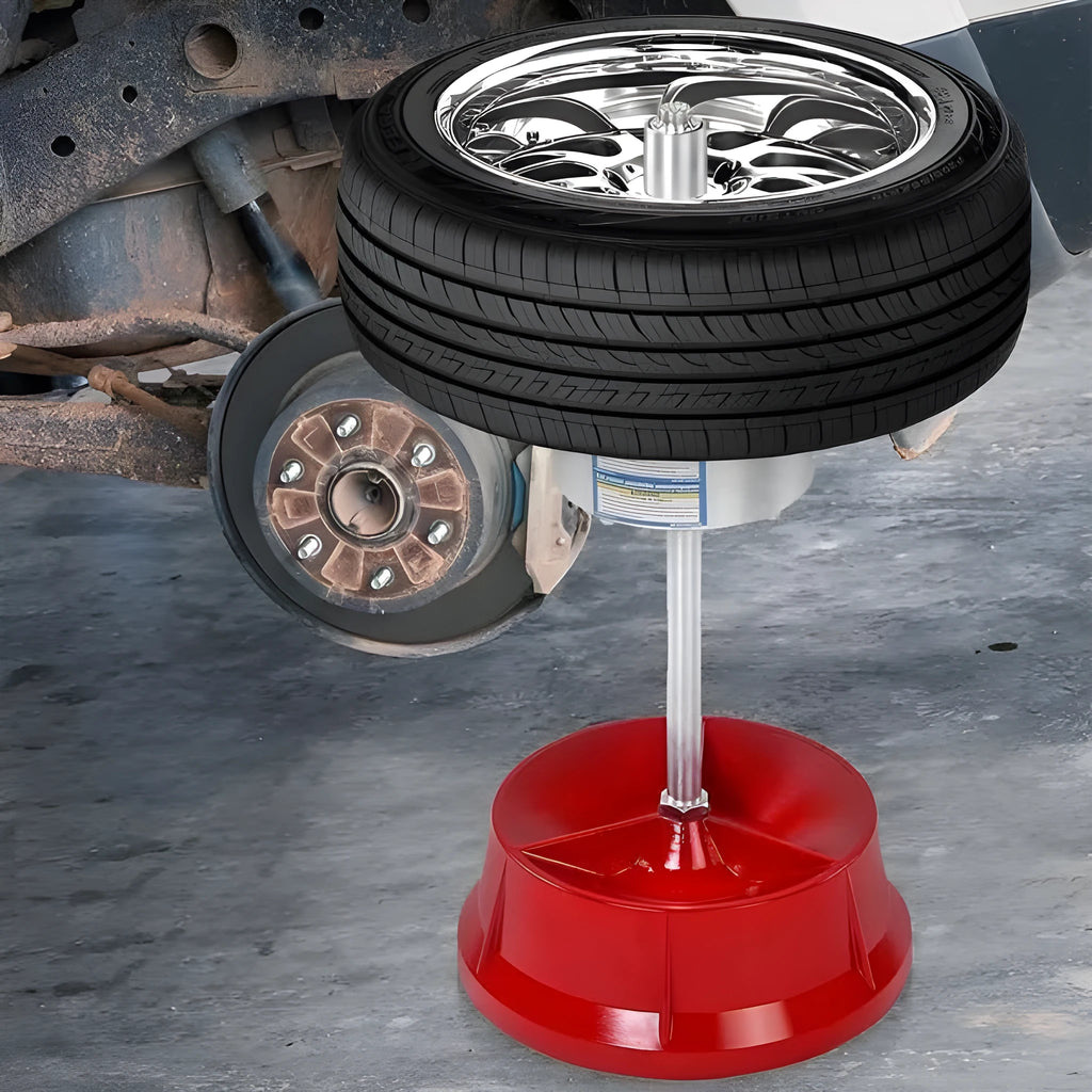 Portable hub balancer with aluminium head for car wheels showing bull's eye level and enamel-finished base