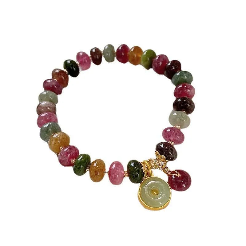 Colourful natural tourmaline abacus bead bracelet with a rabbit pendant charm.