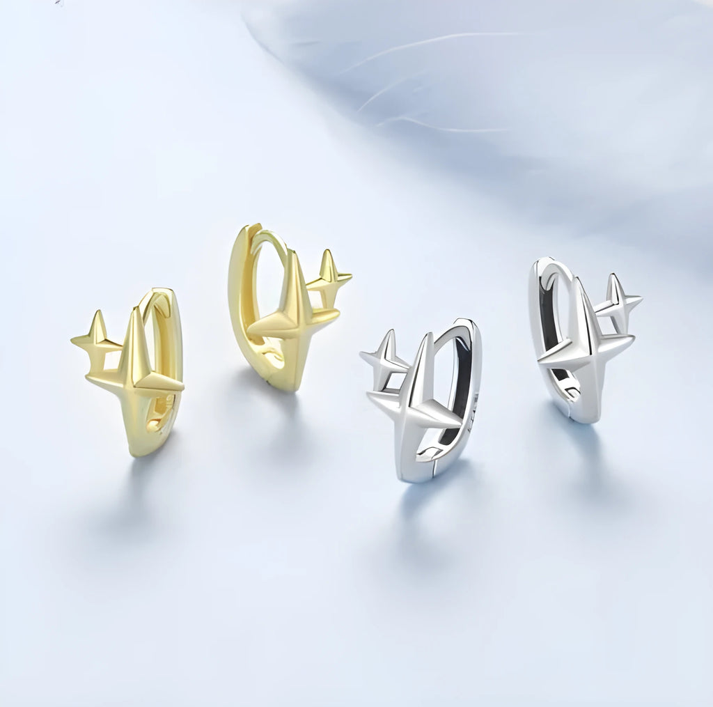 Minimalist silver star clip-on earrings with XINGX detail for women.