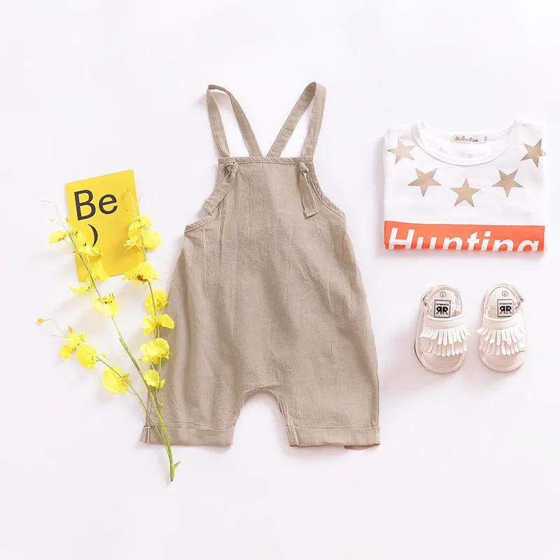 Children's khaki cotton overalls shorts with bow detail and straps, front view