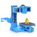 K9 mini desktop 3D printer with compact build chamber, shown in black and blue colour options.