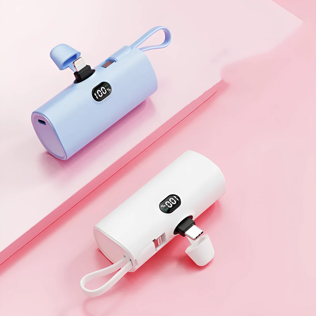 Compact capsule-shaped wireless power bank with digital display and integrated plug in multiple colours.