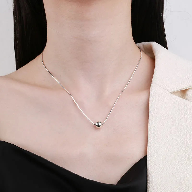 Sterling silver clavicle chain necklace with small ball pendant on delicate chain