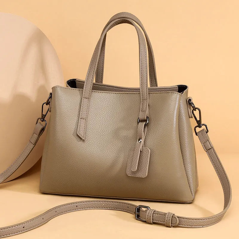 Women's cowhide leather shoulder handbag in horizontal square shape with contrast stitching