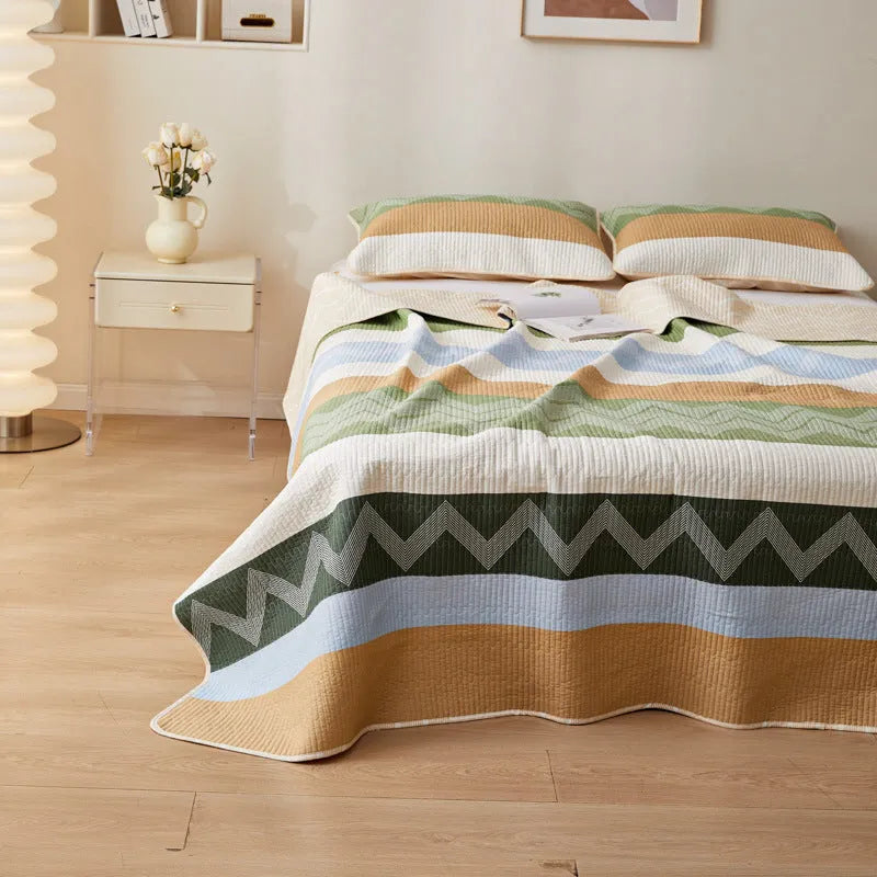 Pure cotton printed bed sheet set in a modern design on a bed, showing bedspread-style drape.