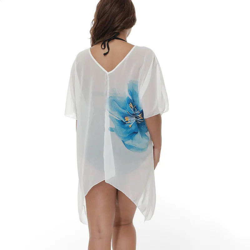 White plus size loose beach cover-up blouse on a hanger