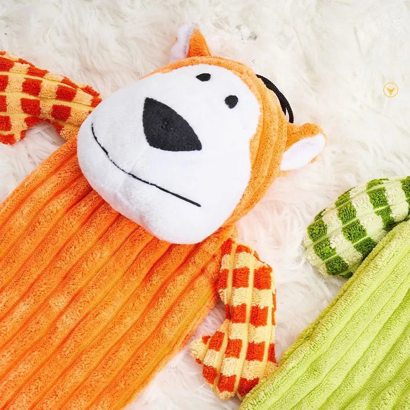 Green and orange plush dog toy with immortal squeaker for aggressive chewers