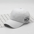 Cotton baseball cap with letter embroidery, adjustable back, curved brim, in beige on white background