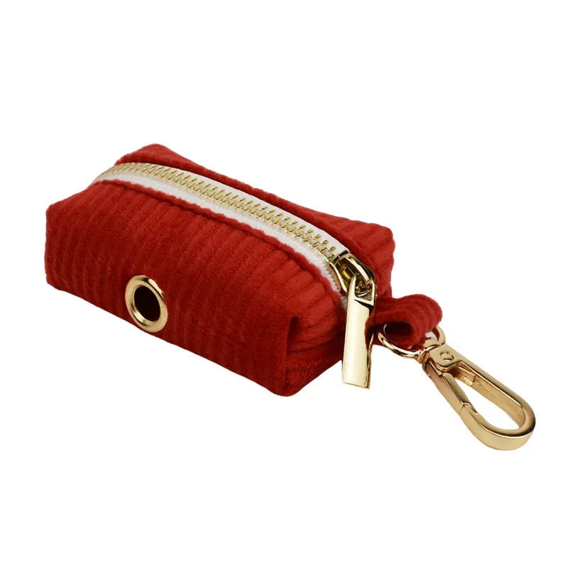 Red corduroy dog collar and matching traction rope set with vest, bow, and poop bag accessories