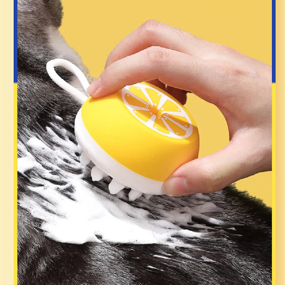 Yellow silicone pet bath brush with soft bristles for dog and cat grooming during bathing
