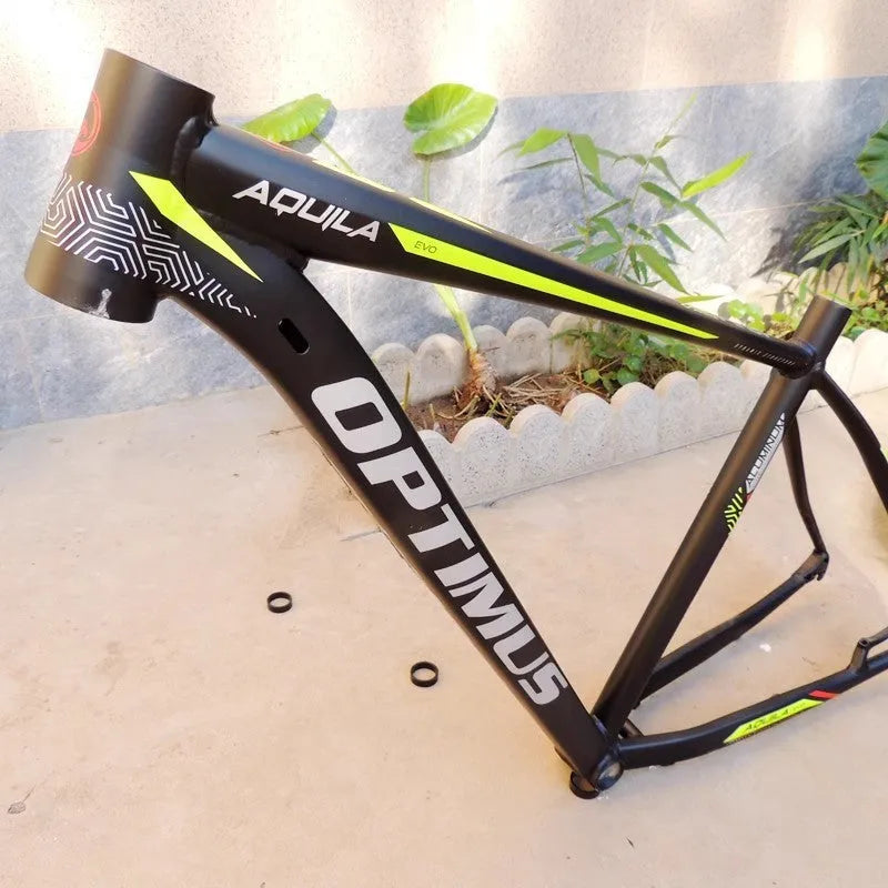 Black green aluminium mountain bike frame for 29-inch wheels with inner cable routing and disc brake mounts.