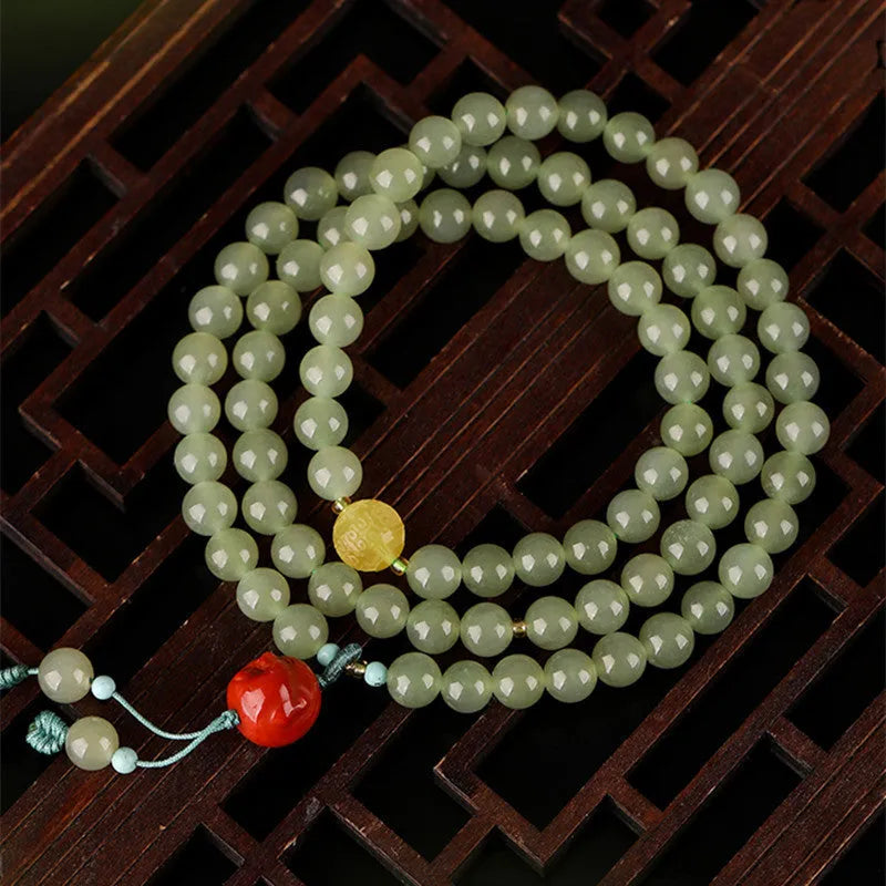 Pale blue Hetian Jade bracelet with 6mm beads in three circle female design