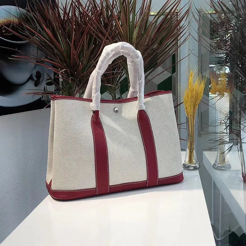 Women's canvas bucket tote bag with leather trim showing 25cm and 30cm size options