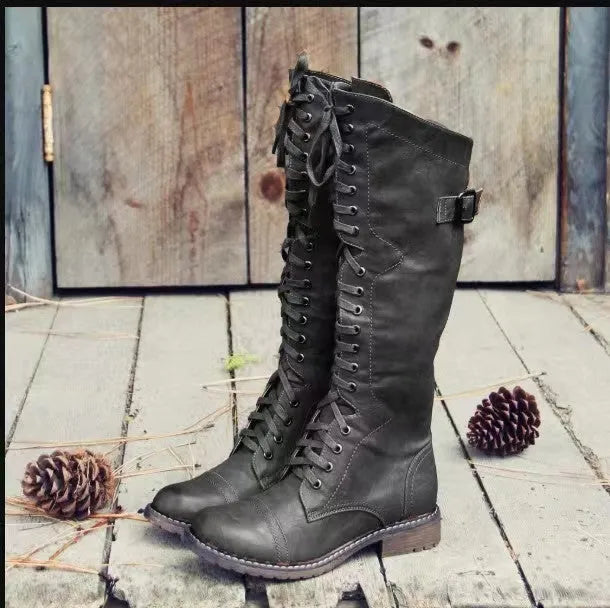 Chunky heel high leg boots in black colour with round toe and low heel