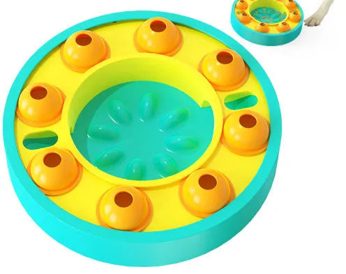 Round blue interactive dog slow feeder puzzle toy with central column and food turntable on a table