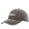 Retro personalised washed distressed embroidered peaked cap in beige with adjustable snapback.