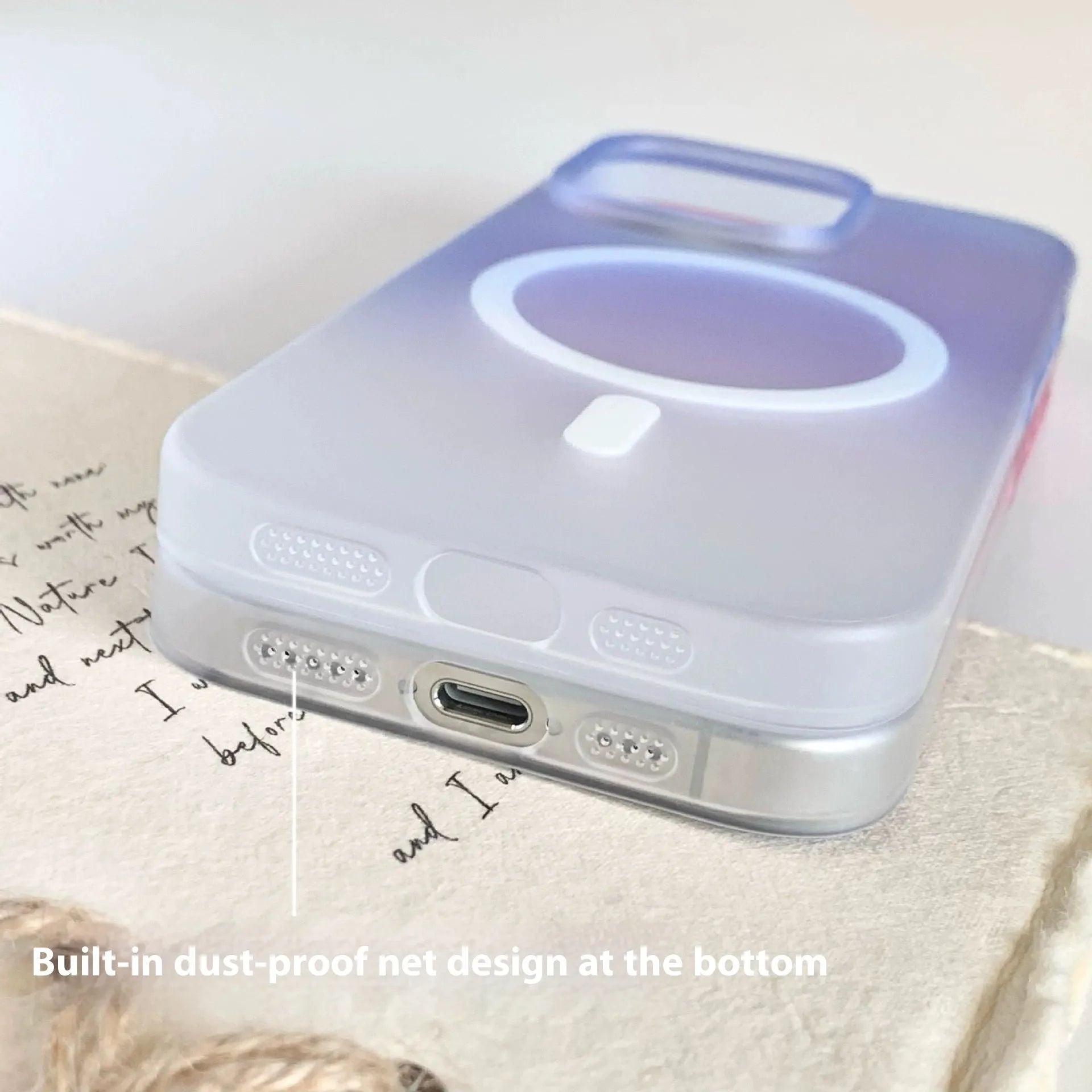 Gradient frosted magnetic suction case for iPhone on a table, showing ultra-thin profile and colour blend.