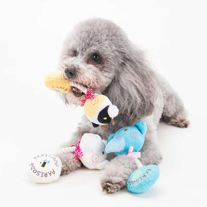 Dog plush toy with squeaker and cotton rope in animal designs including frog, elephant, cow, and bear