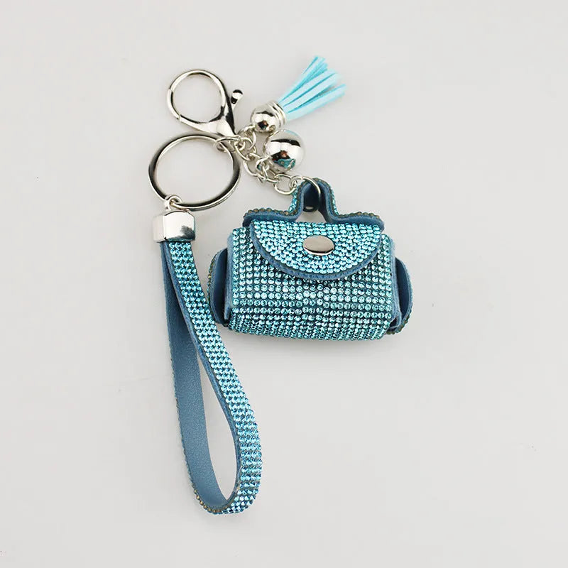 Leather diamond coin purse earphone bag in black with zip closure and keychain pendant