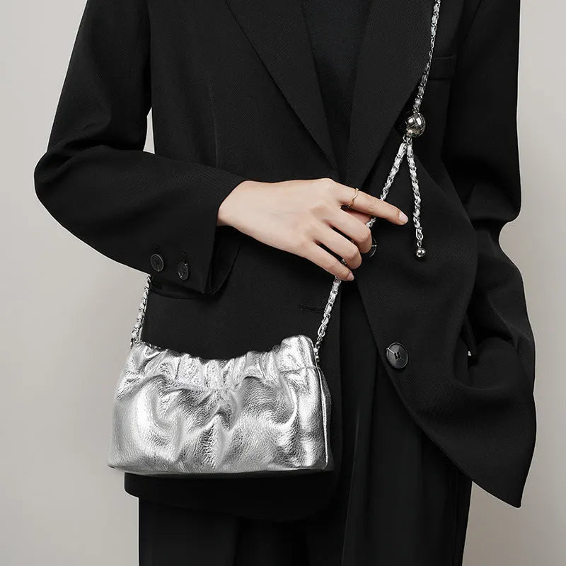 Women's soft leather dumpling-shaped crossbody bag in grey with a single strap