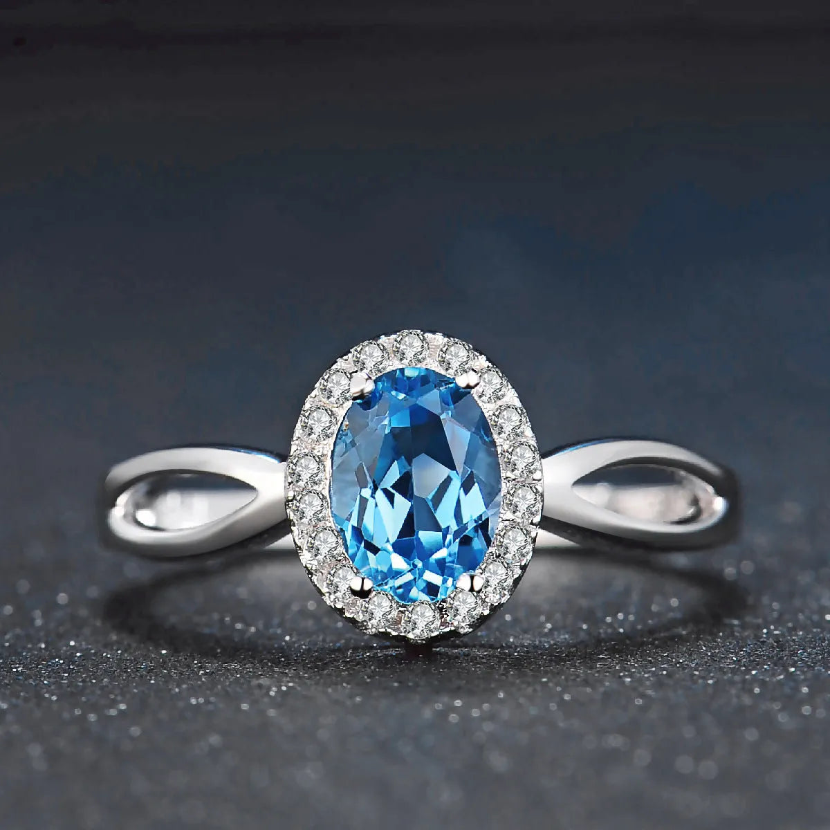 925 sterling silver jewellery set with blue topaz gemstones including earrings, ring, pendant and necklace