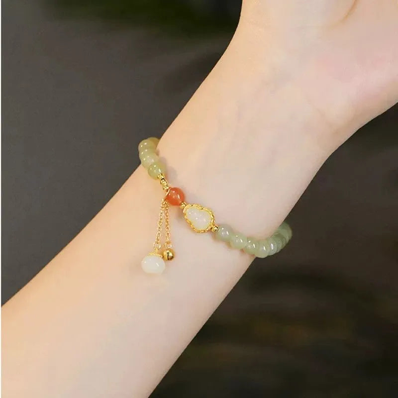 Jade women's bracelet with gold plated gourd charm and fu character decoration