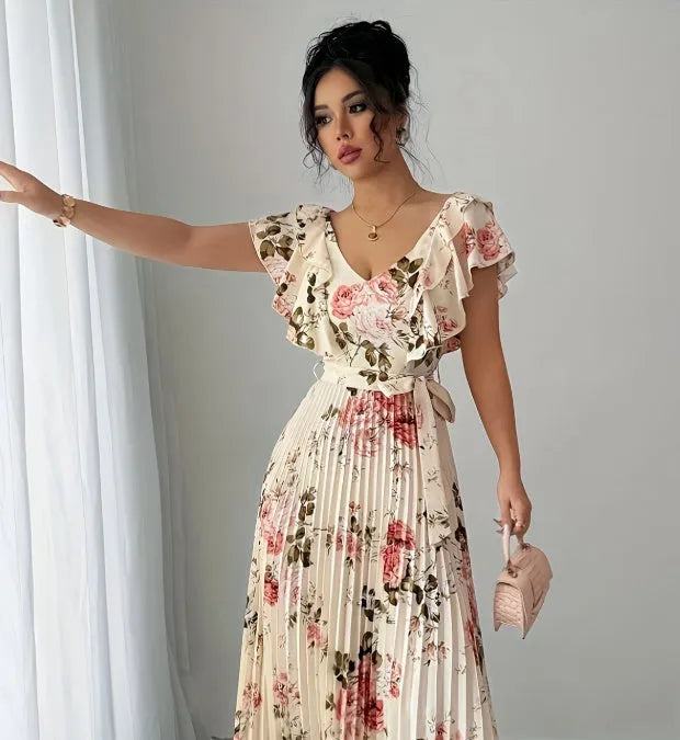 Apricot-coloured women's floral print dress with a V-neck, ruffled short sleeves, and an oversized pleated skirt.