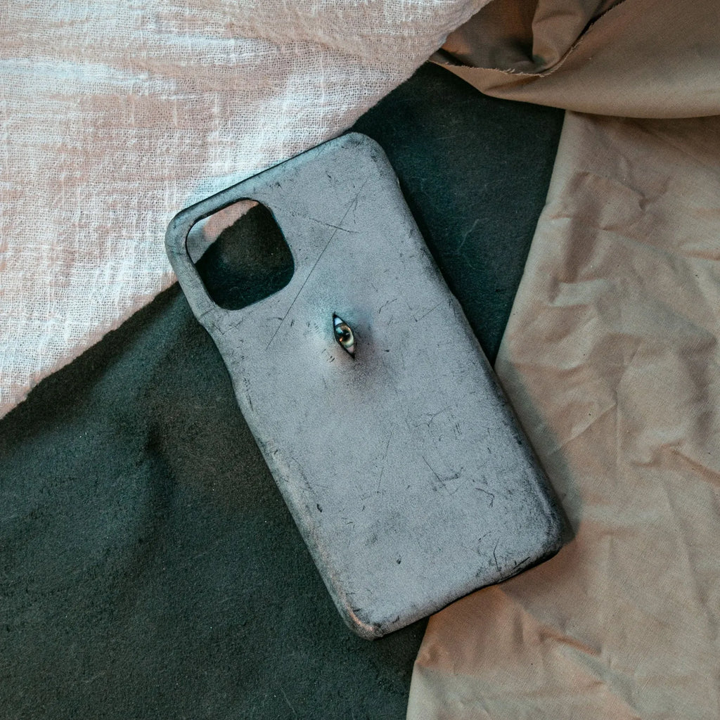 Vintage distressed cowhide leather phone case with textured grip, compatible with iPhone models 15 to 8 Plus, single eye style
