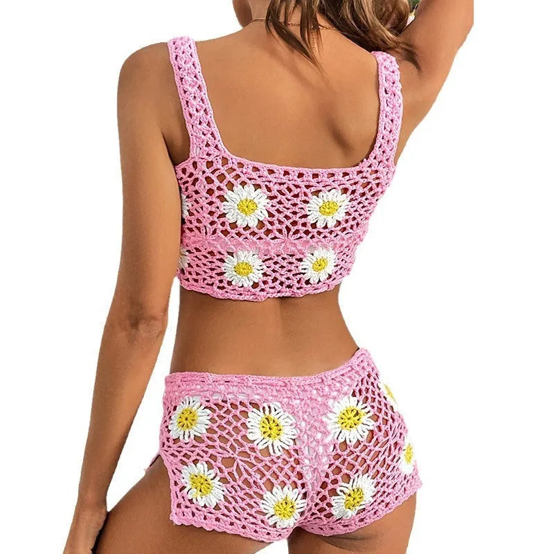 Light green floral vest top and bikini bottom swimsuit set laid flat.