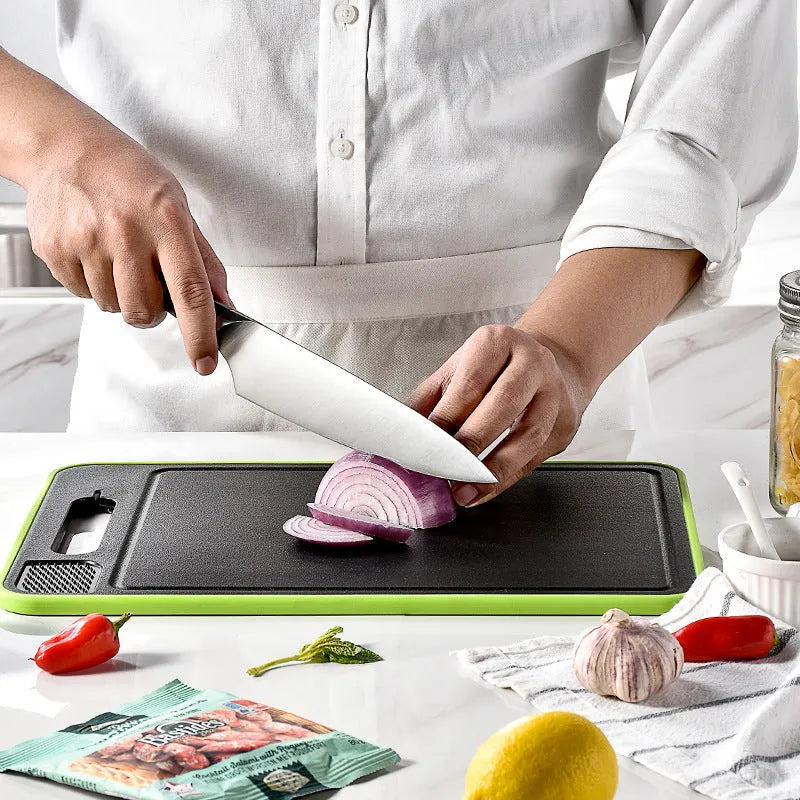 Grey square aluminium cutting board with integrated knife sharpener and grinding teeth