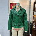 Punk style short jacket with a Peter Pan collar on a hanger, showing the drawstring waist.